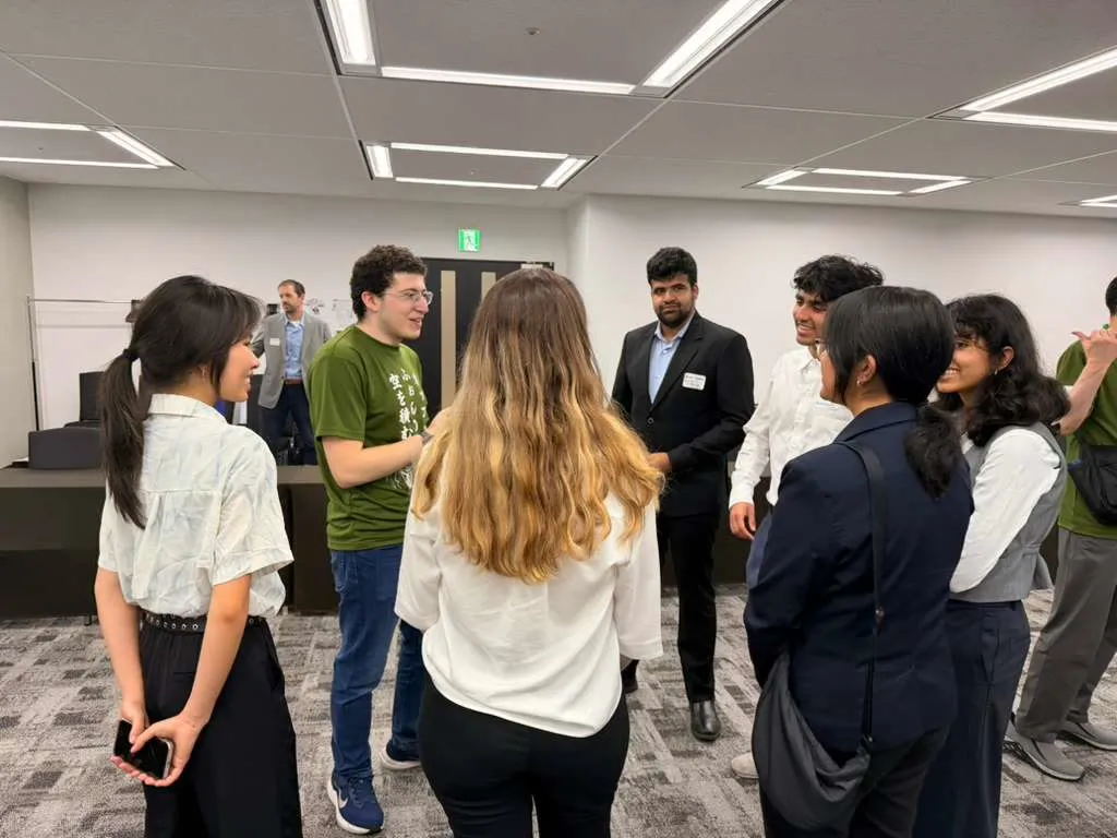 Talking with a group of students during the networking part