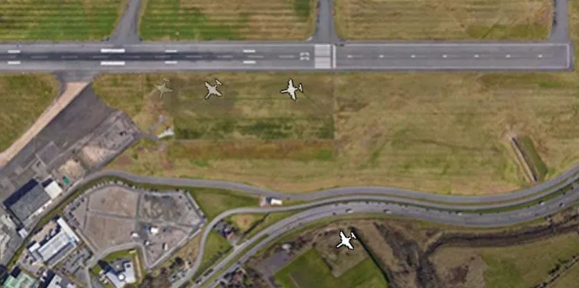 An aircraft going around in the simulation, with its predicted positions wrongly bending back towards the taxiways