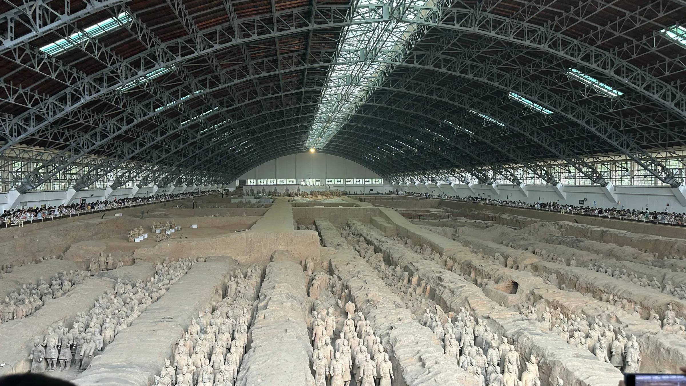Rows of terracotta warriors in the vast main pit, under its arched roof