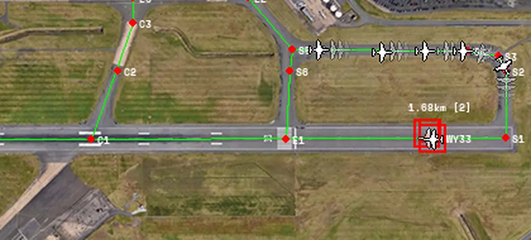 Departures queueing for the runway in the simulation, with each aircraft's predicted positions drawn faintly ahead of it