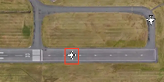 The detection box around an aircraft on the runway in the simulation